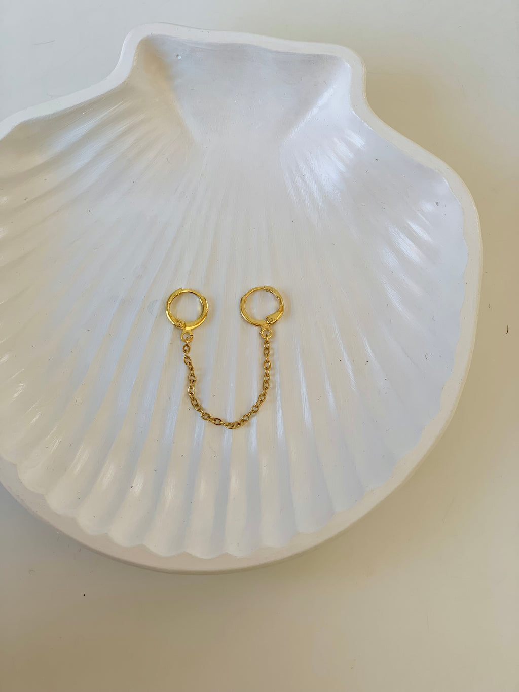 Gold chain piercing